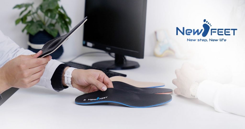 New Feet orthopedic insoles on a desk during a patient consultation